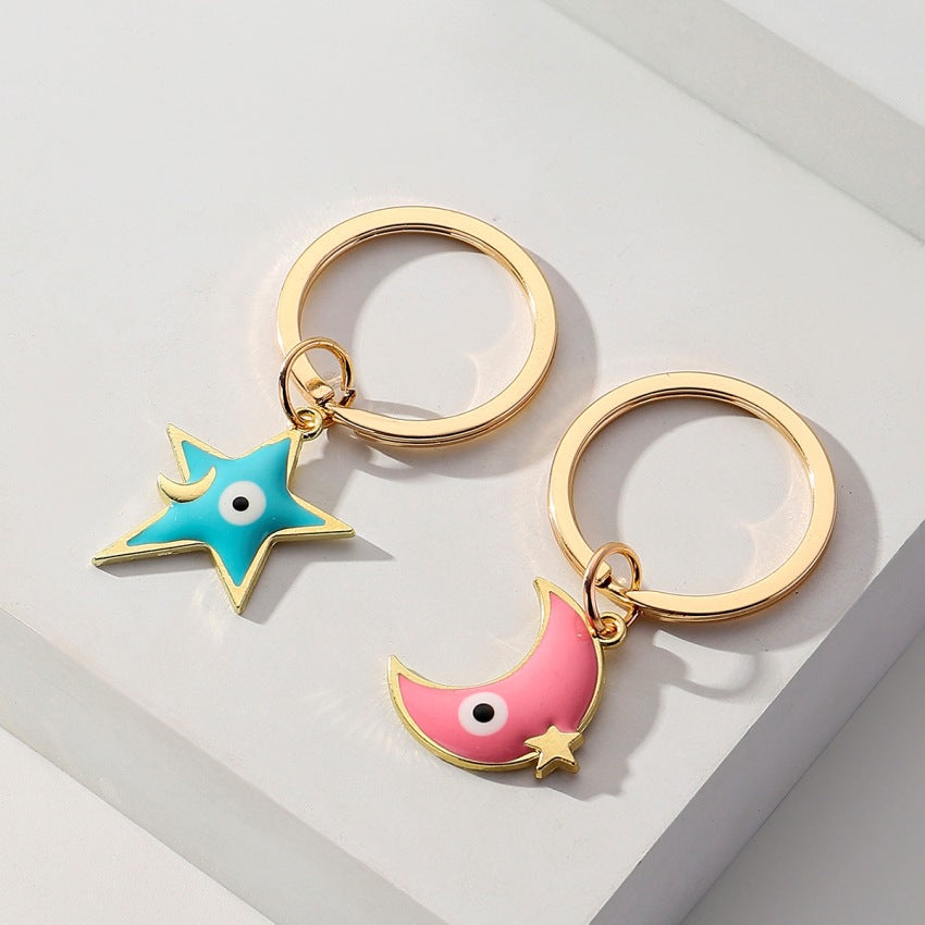 Wholesale Star Moon Demon Eye Couple Metal Keychains